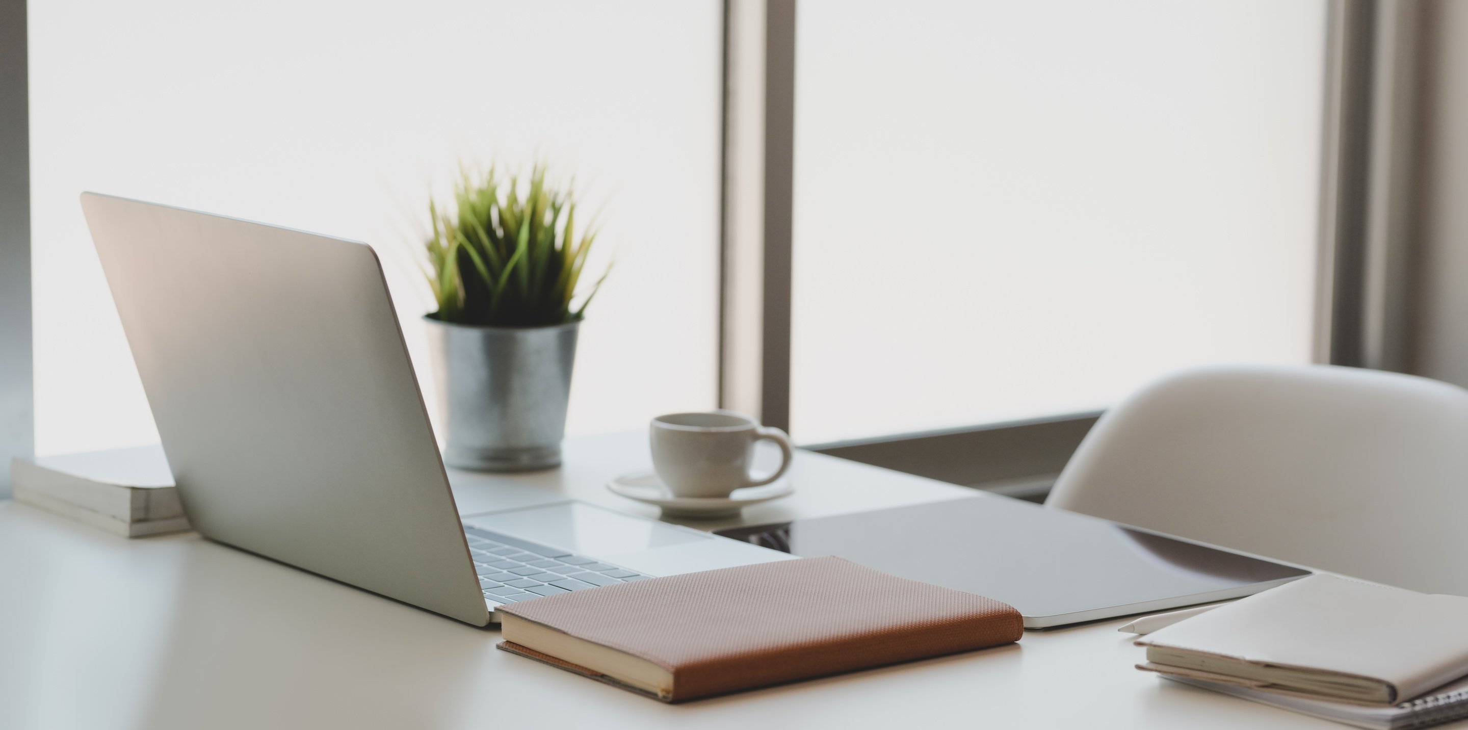 Silver Macbook on White Table